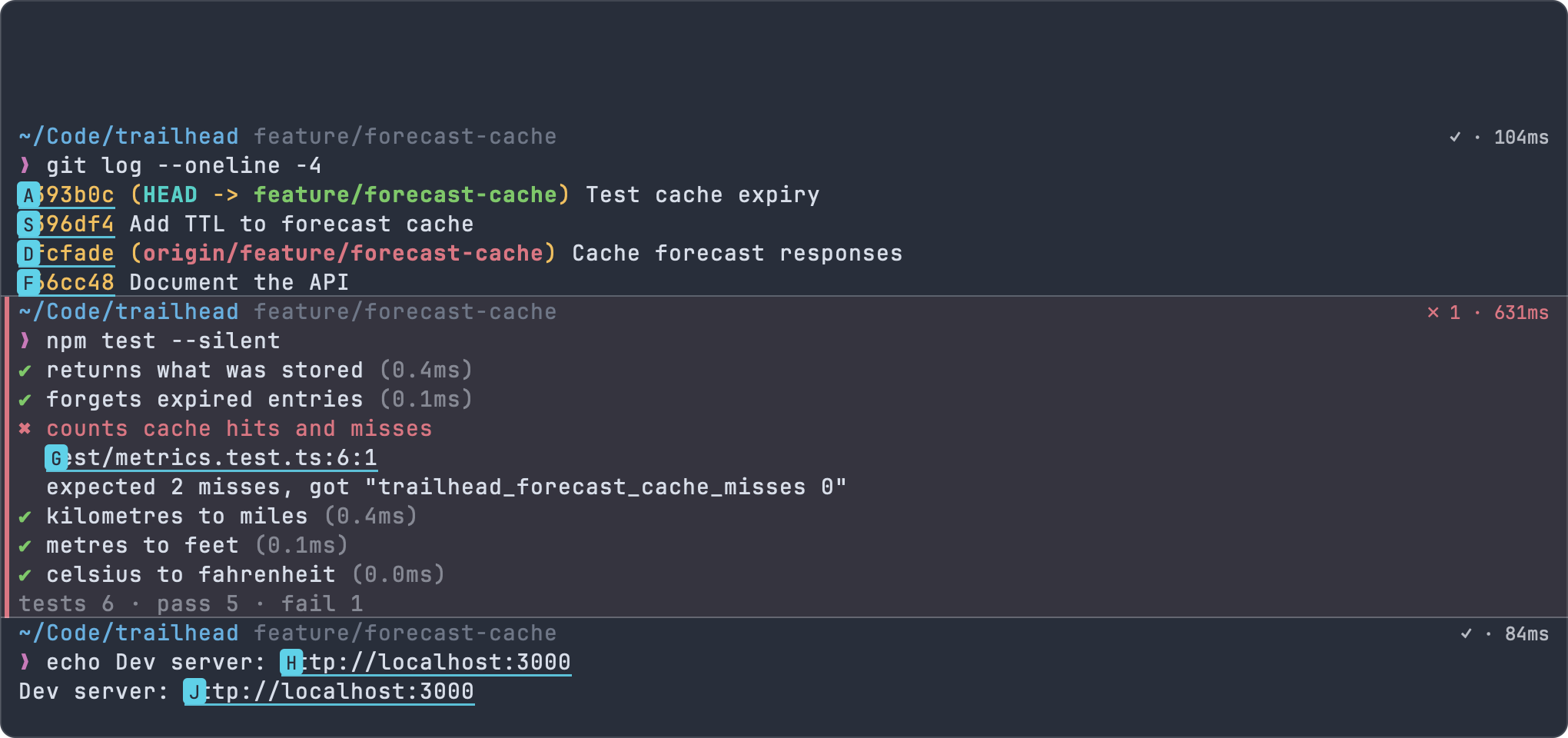 Hints mode: letter labels over commit SHAs, a test file reference and a localhost URL in the terminal output